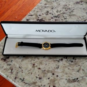 Movado gold blk strap watch